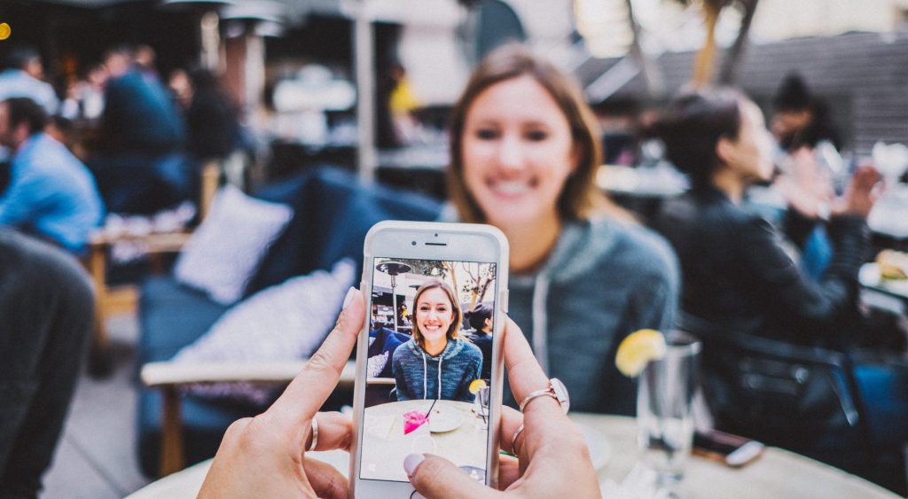 woman taking a photo of a friend.jpg