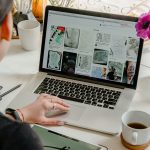 Photo of person using laptop for graphic designs