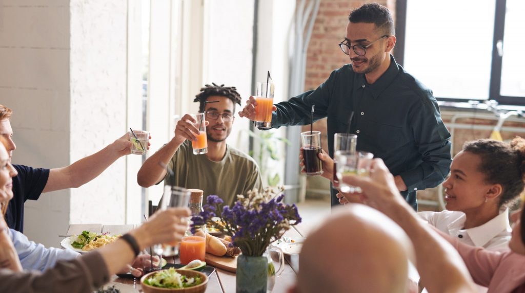 Group of friends making toast