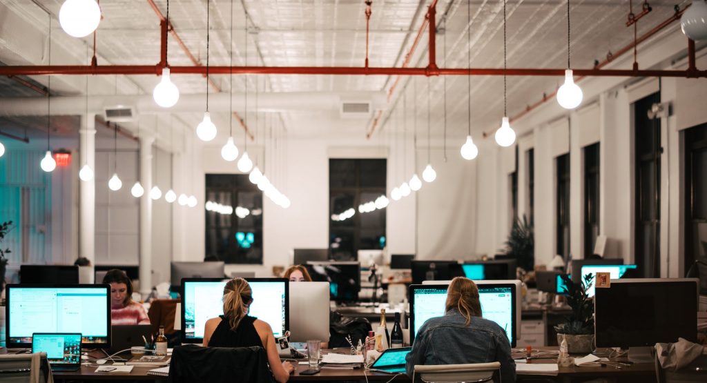 people sitting on chair in front of computer