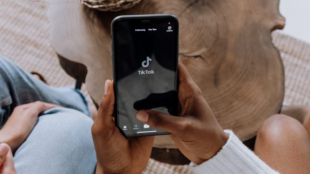 Person holding black android smartphone