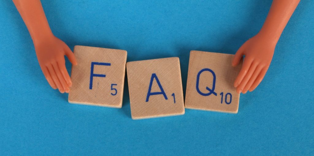 Close up shot of scrabble tiles on a blue surface