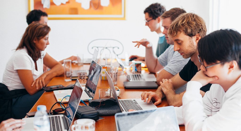 Group of people using laptops